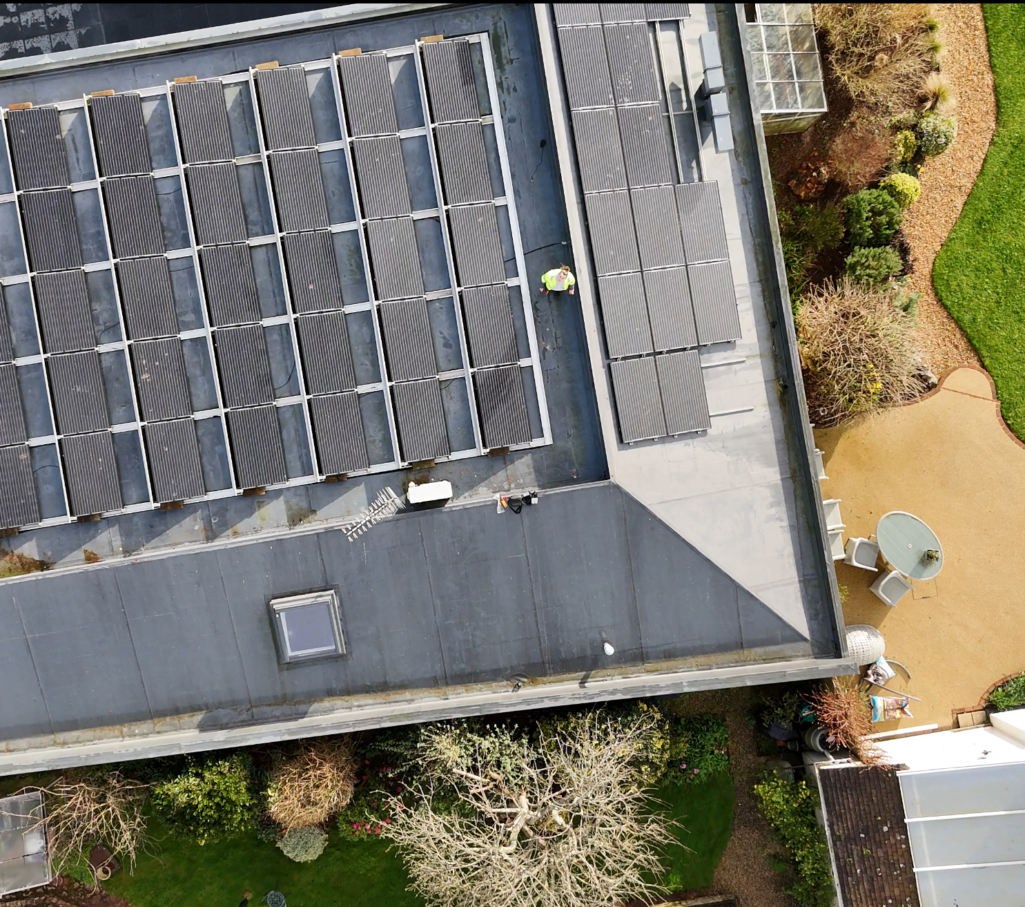 Overhead view of a commercial flat roof solar installation completed by Engage Solar in Devon