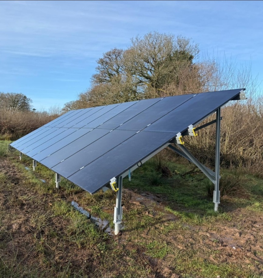 Ground mounted solar array installed on open land by Engage Solar in rural Devon