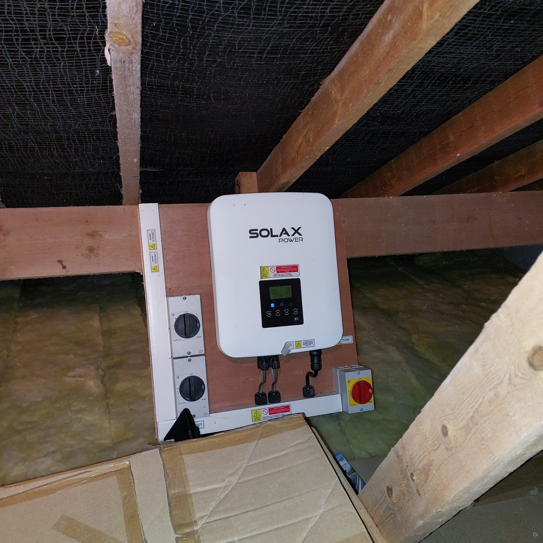 Solar inverter inspection carried out in a loft space as part of a Devon home buyer solar survey