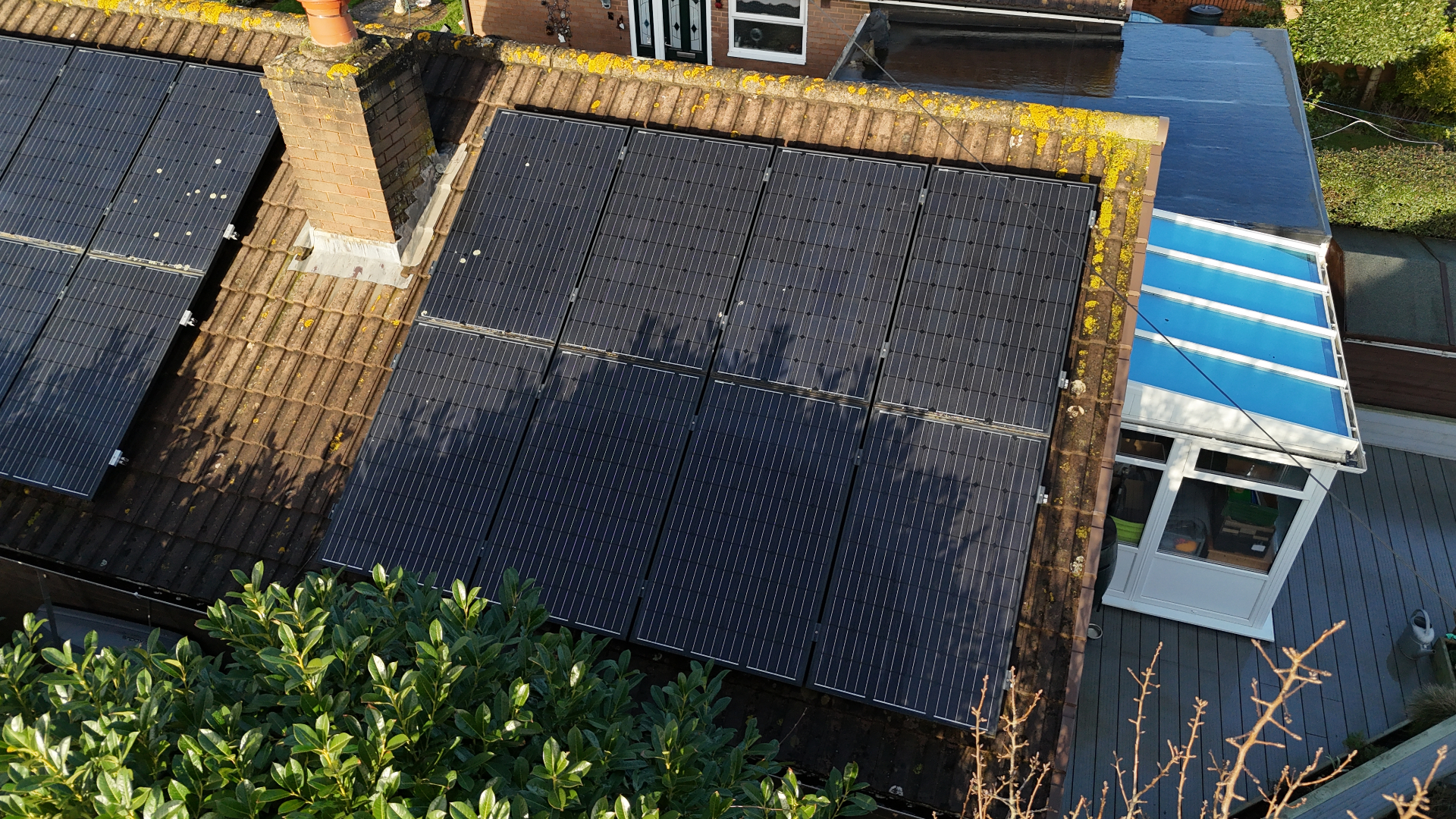 Drone survey view of rooftop solar panels on a Devon home